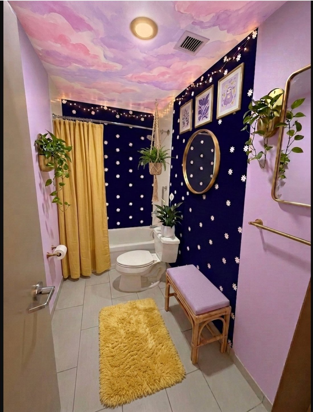 Concept rendering of the bathroom with watercolor cloud ceiling, navy daisy walls, lilac accent wall, brass fixtures, and yellow shag rug