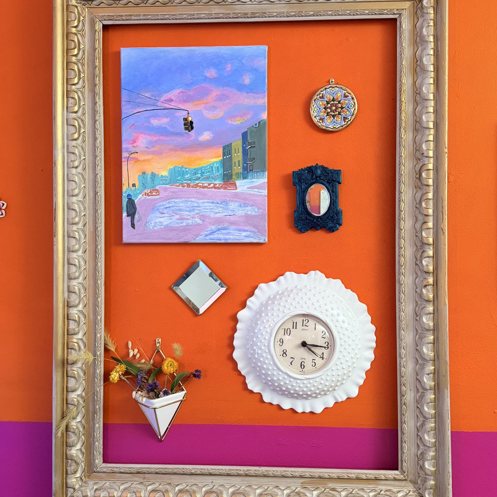 Ashley's gallery wall, orange and pink, framed art, mirror, clock, and dried flowers